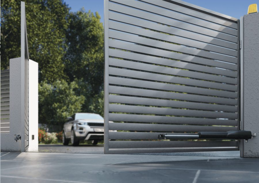 Silver slatted swing gate opening automatically with a CAME arm motor