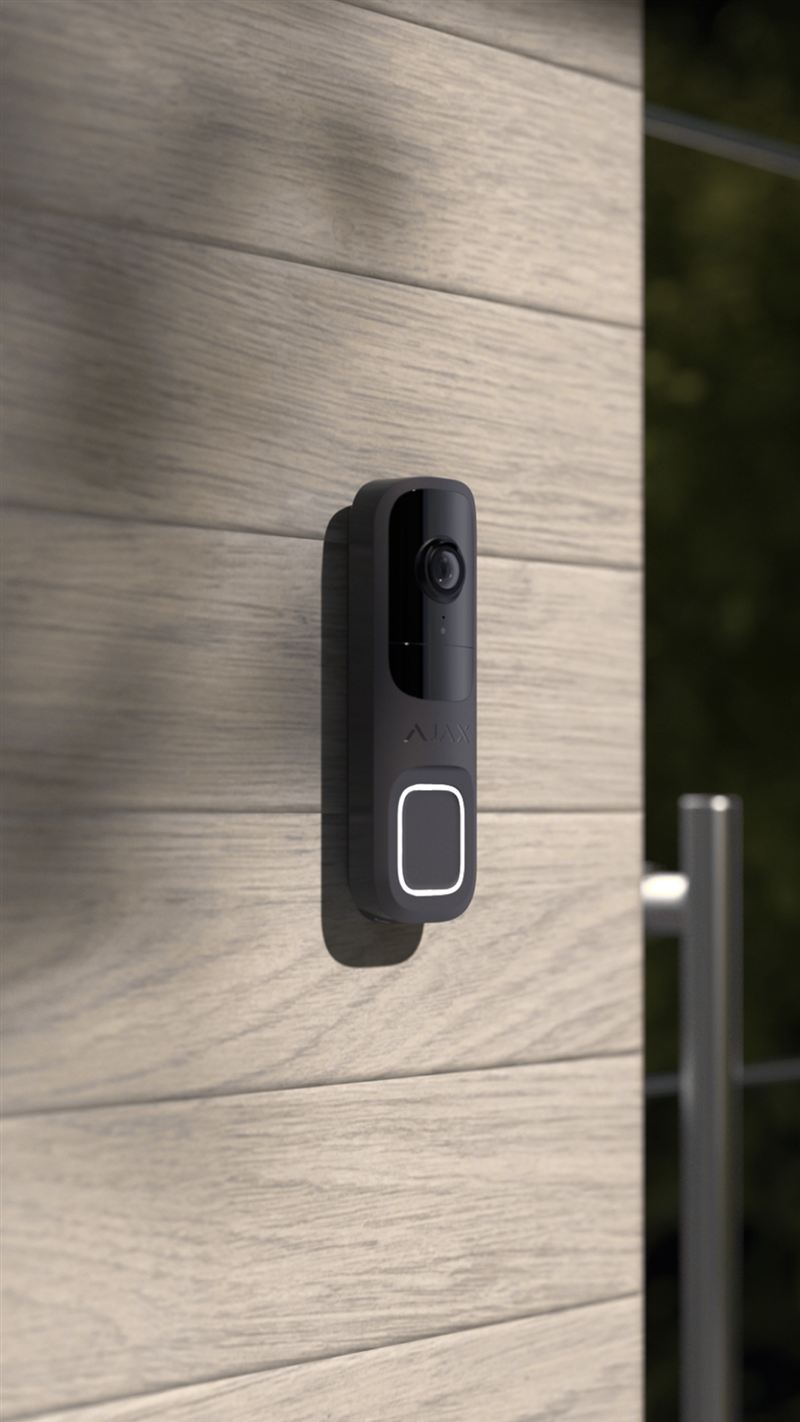 Ajax video doorbell mounted on a timber clad wall